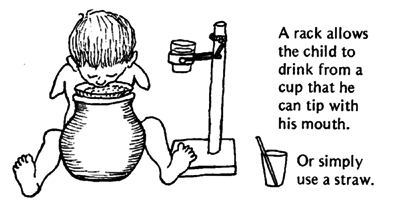 A rack allows the child to drink from a cup that he can tip with his mouth,
