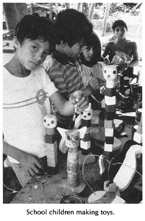 School children making toys