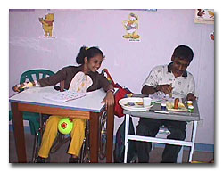 image:Two childrenTwo children with PC getting skills development assistance