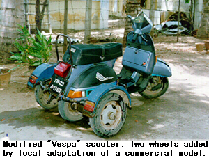 Modified 'Vespa' scooter: Two wheels added by local adaptation of a commercial model.