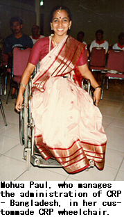 Mohua Paul, who manages the administration of CRP Bangladesh, in her custom-made CRP wheelchair.