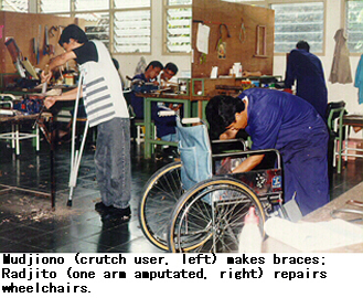 Mudjiono (crutch user, left) makes braces; Radjito (one arm amputated, right) repairs wheelchairs.