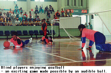 Blind players enjoying goalball an exciting game made possible by an audible ball.