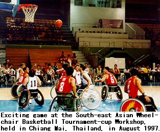 Exciting game at the South-east Asian Wheelchair Basketball Tournament-cup Workshop, held in Chiang Mai, Thailand, in August 1997.