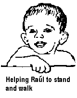 Helping Raúl to stand and walk.