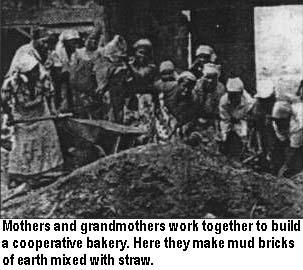 Mothers and grandmothers work together to build a cooperative bakery. Here they make mud bricks of earth mixed with straw.