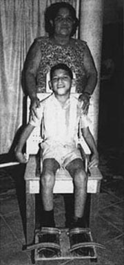 A boy looks feeling fine by sitting on the adjustable chair.