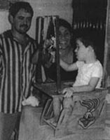 A child is playing with toys hanging from the bar.(photo 2)