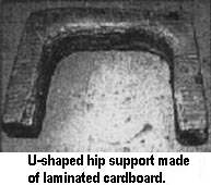 U-shaped hip support made of laminated cardboard.