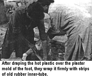 After draping the hot plastic over the plaster mold of the foot, they wrap it firmly with strips of old rubber inner-tube.
