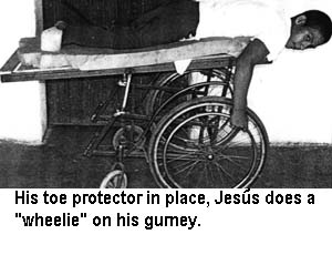 His toe protector in place, Jesús does a "wheelie" on his gurney.