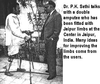 Dr. P.K. Sethi talks with a double amputee who has been fitted with Jaipur limbs at the Center in Jaipur, India. Many ideas for improving the limbs come from the users.
