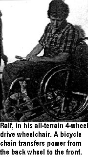 Ralf, in his all-terrain 4-wheel drive wheelchair. A bicycle chain transfers power from the back wheel to the front.