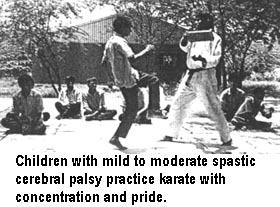 Children with mild to moderate spastic cerebral palsy practice karate with concentration and pride.