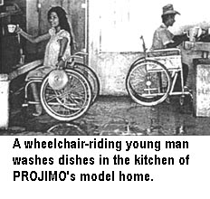 A wheelchair-riding young man washes dishes in the kitchen of PROJIMO's model home.