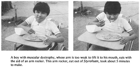 A boy with muscular dystrophy eats with the aid of an arm rocker.