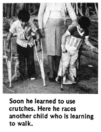 Soon he learned to use crutches. Here he races another child who is learning to walk.