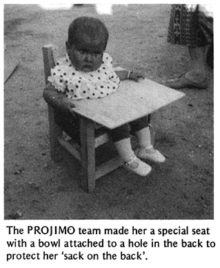 The PROJIMO team made her a special seat with a bowl attached to a hole in the back to protect her 'sack on the back'.