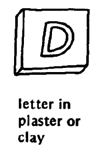 Letter in plaster or clay.
