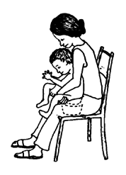 The pot can be placed between mother's knees, for the child severely disabled with cerebral palsy.
