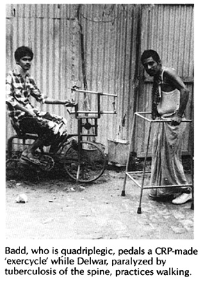 Badd pedals a CRP-made 'exercycle' while Delwar, paralyzed by tuberculosis of the spine, practices walking.