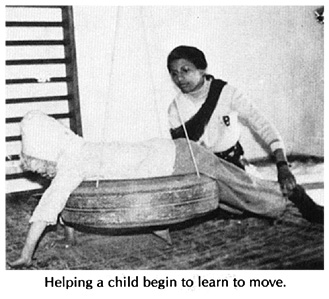 Helping a child begin to learn to move.