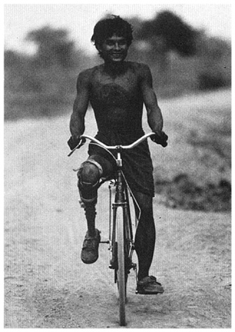A person who rides a bicycle.
