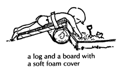 A log and board with a soft foam cover. 