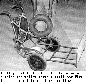 Trolley toilet: The tube functions as a cushion and toilet seat; a small pot fits into the metal frame of the trolley.