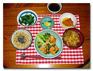 photo of several bowls of food arranged on a table on a red and white checkered placemat