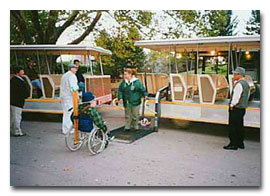 photo of wheelchair riding tourist boarding tour trolley