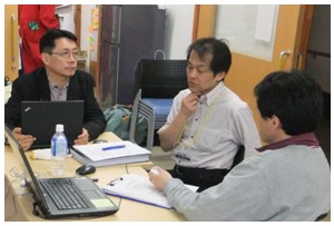 JDF Secretary-General Fujii discussing with office staff on the Center's action program