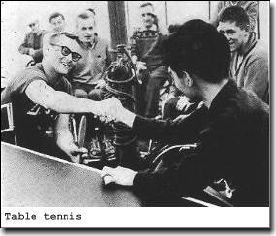 Table tennis players shake hands
