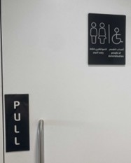 Photo of the sign on a toilet door