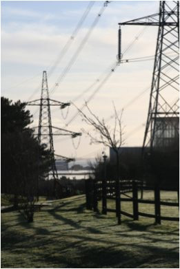 power lines in a mixed industrial and agricultural setting /